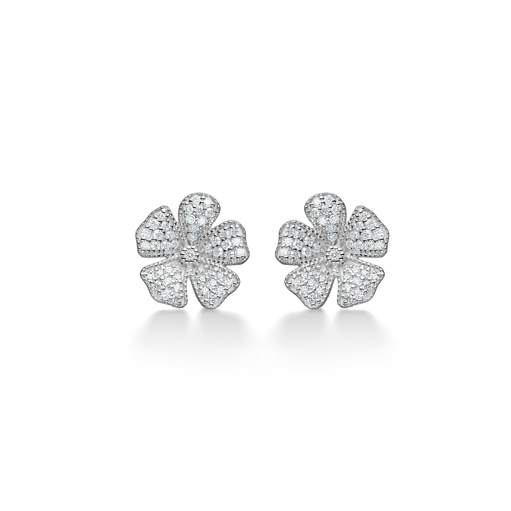 Flower earrings in silver color with clear stones, front view of detailed jewelry design.