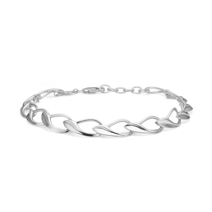 Smykke armbånd i sølv med dekorative led og små sten på en sort baggrund.