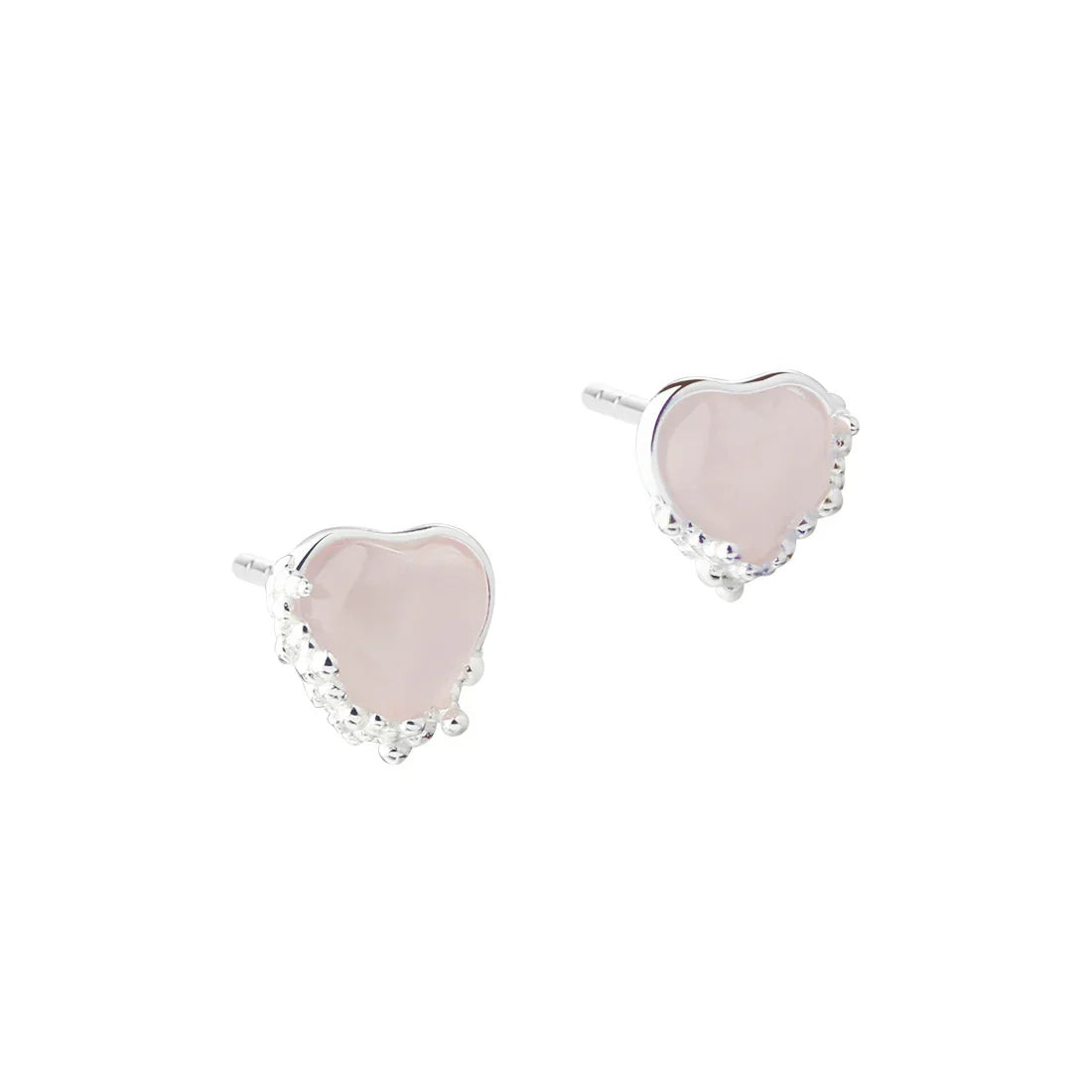 Heart-shaped earrings in silver with pink stones, front view of the jewelery in pairs