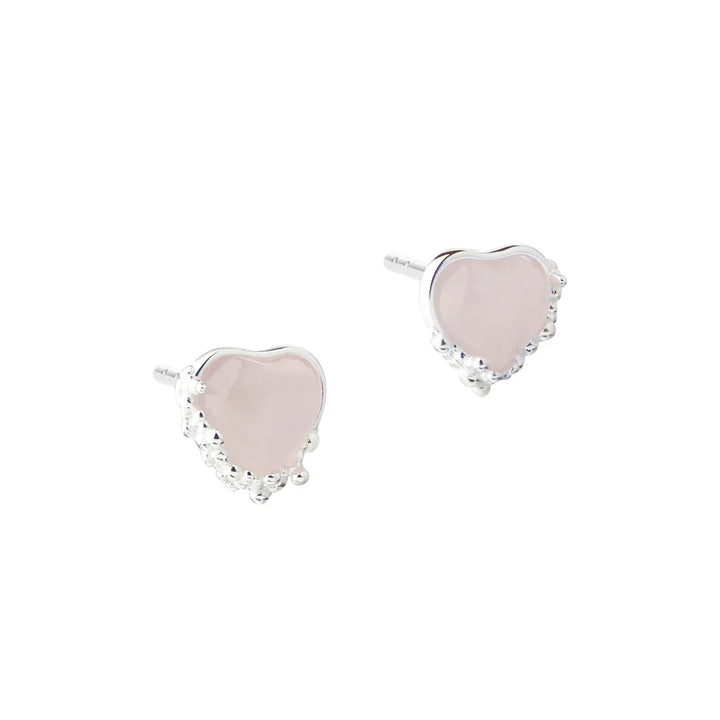 Heart-shaped earrings in silver with pink stones, front view of the jewelery in pairs