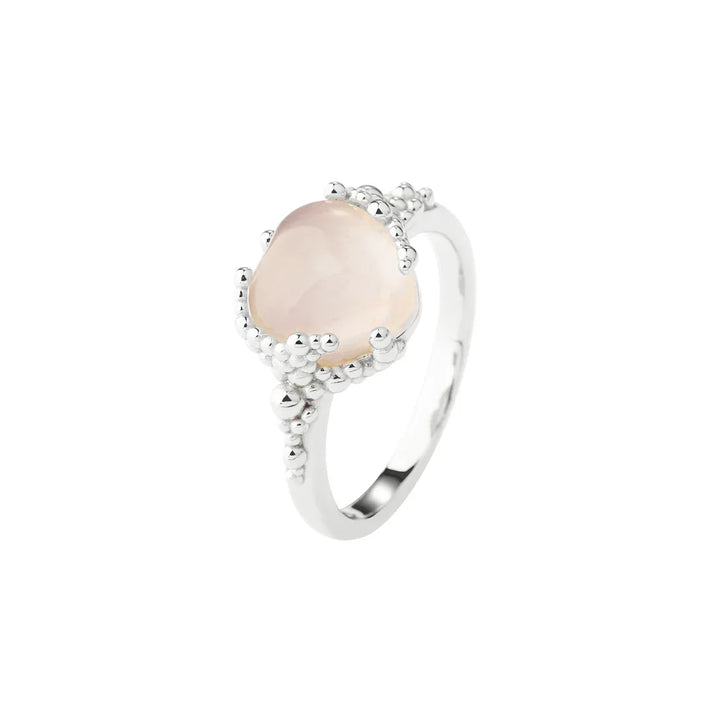 Silver ring with pink stone and organic ball details, front view