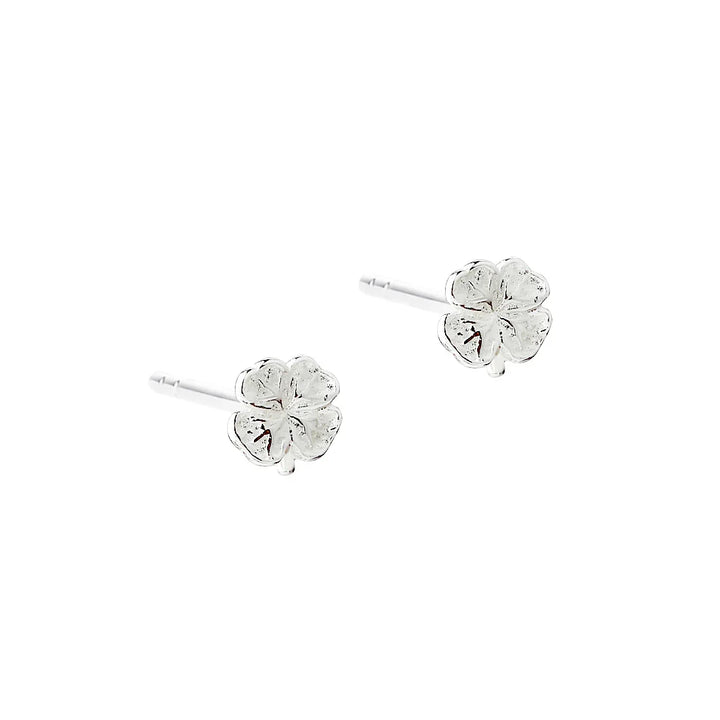 Silver ear studs shaped like four leaf clover, front view, simple and feminine style