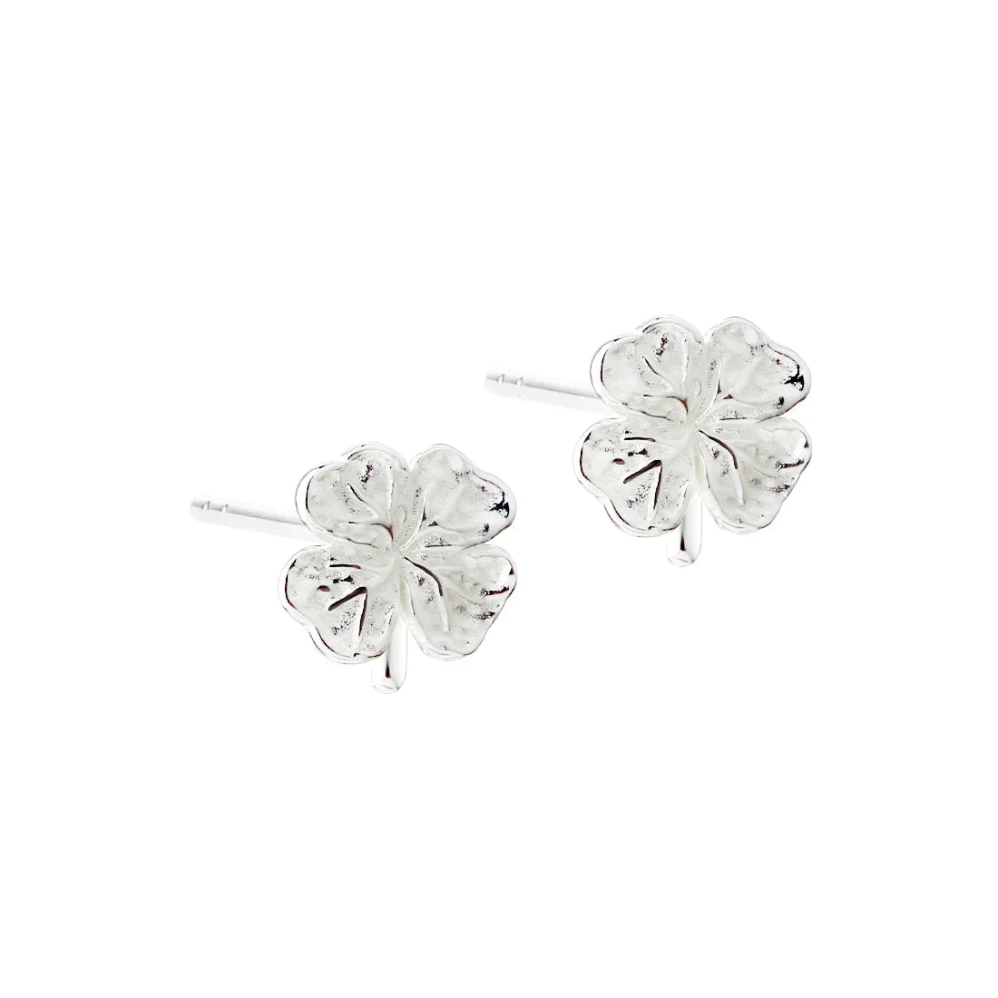 Silver four-leaf clover ear studs, obverse, detailed floral design, polished surface
