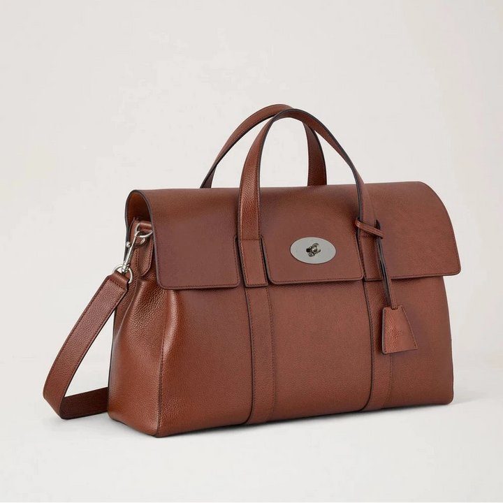 Mulberry taske i brunt læder med håndtag og skulderrem mod en lys baggrund. Model 1123456789