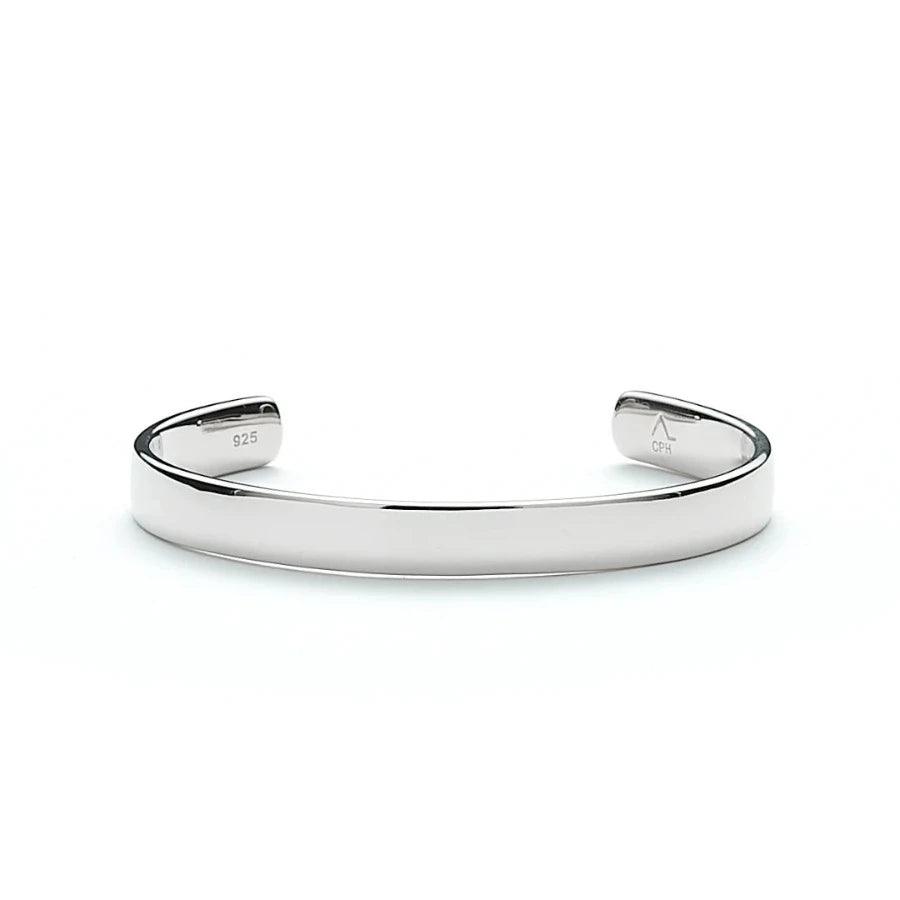 Alexander Lyngaard Hope Bangle in silver shows a stylish, polished bangle in 925 sterling silver. Model h20013-003-1