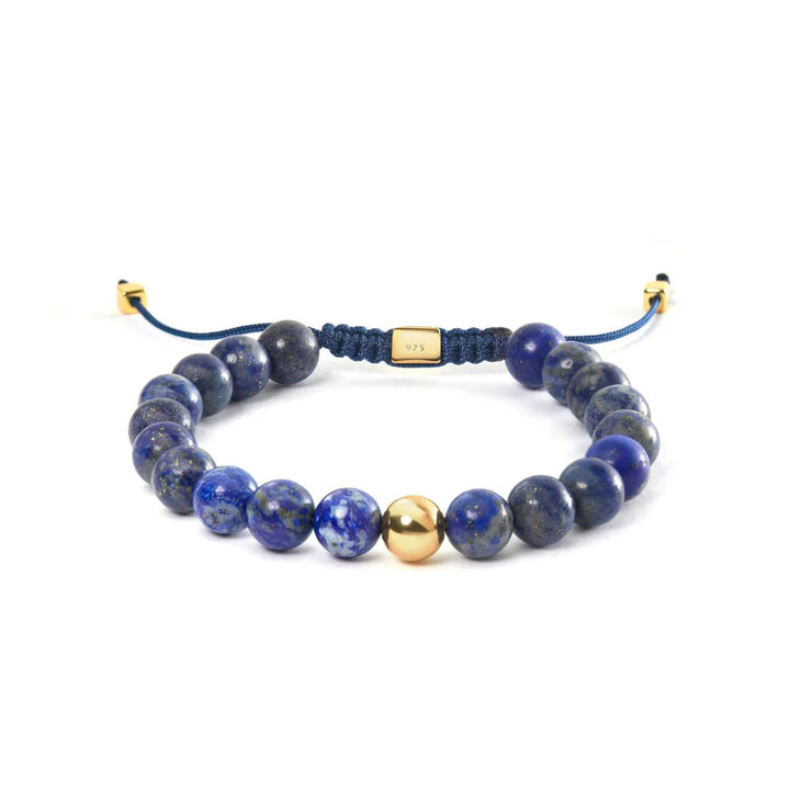 Alexander Lynggaard Armband Lapis Braided 8mm with blue stone beads, gold-colored detail and adjustable cord. Model B00163-2.