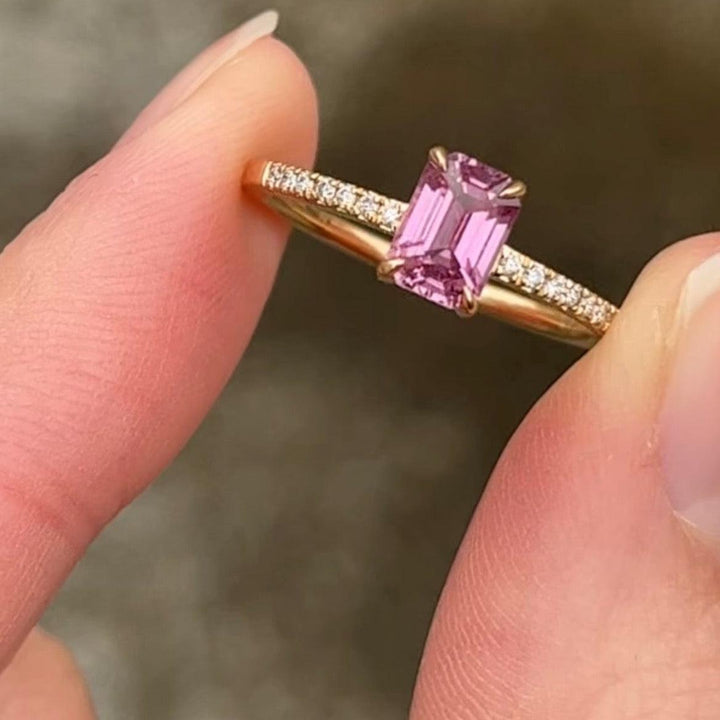 Anpe Atelier Custom Made Ring Pink Sapphire shown close up, with rectangular pink sapphire in gold ring set with small diamonds. Model 27-customized3-001-1