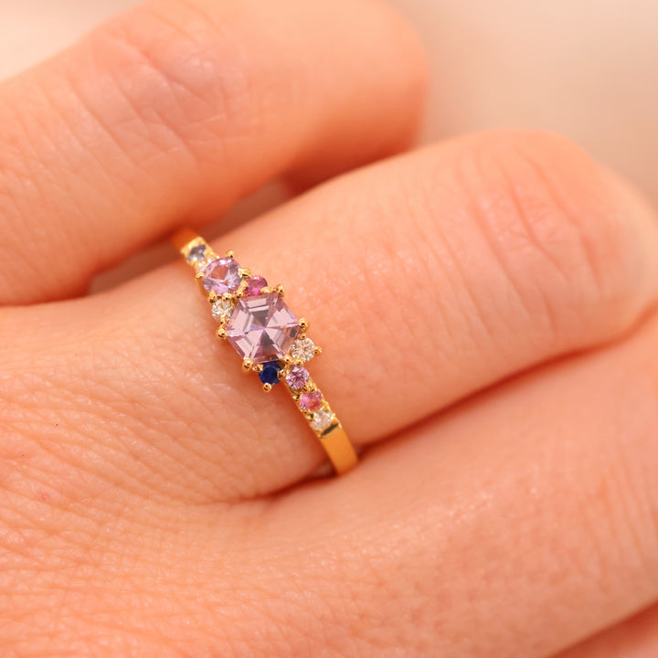 anpé atelier varnaya kuda ring 18kt gold custom made appears on finger with purple and pink stones, Model 27-custom1-001-2