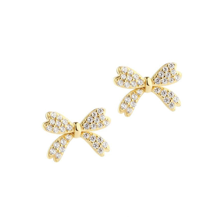 Aqua Dulce Big Darling Bow earrings gold-plated with clear stone details, shaped like bows. Model 5805-1