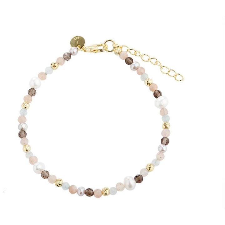 Aqua Dulce Miah Bracelet in gold-plated silver with multicolored pearls on a white background. Model 5412-5412-1