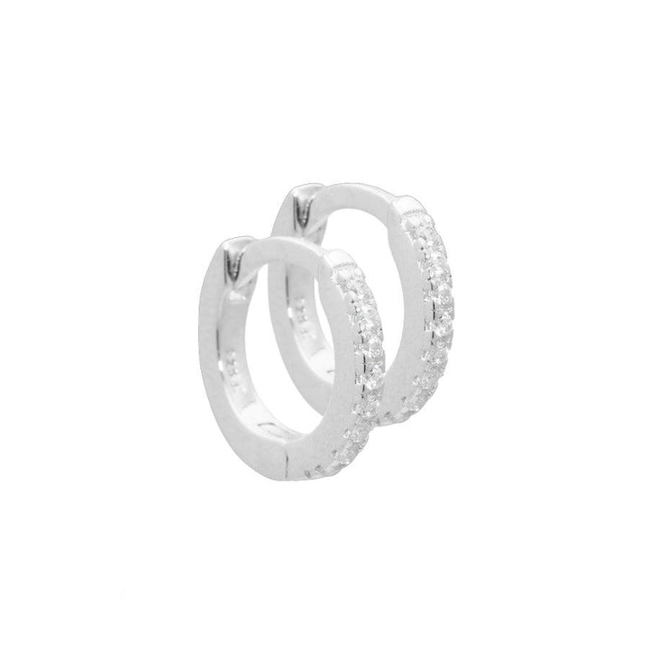 Aqua Dulce Raya Creole Silver shows a pair of small creoles in silver with clear sparkling stones, Model 4036-4036-1.