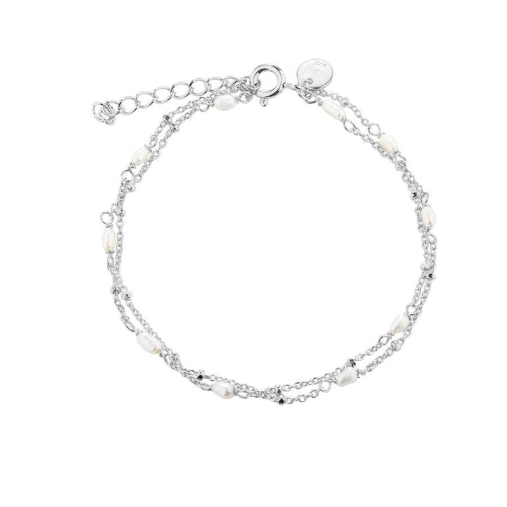 Aqua Dulce Rice Dot Double Bracelet with double silver chains and small white pearls. Model 5371-5371-1