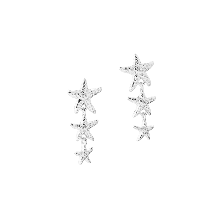 Aqua Dulce Stella Long earrings in silver with three star-shaped details, glossy surface. Model 6157-1