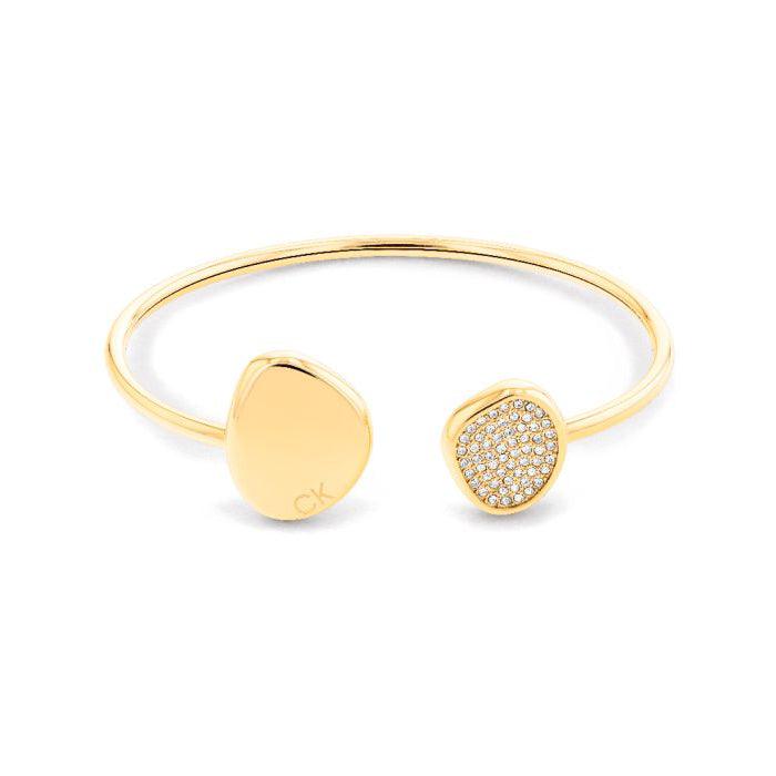 Calvin Klein Enchant Bangle bracelet in gold with organic shape and shiny details. Model 35000215