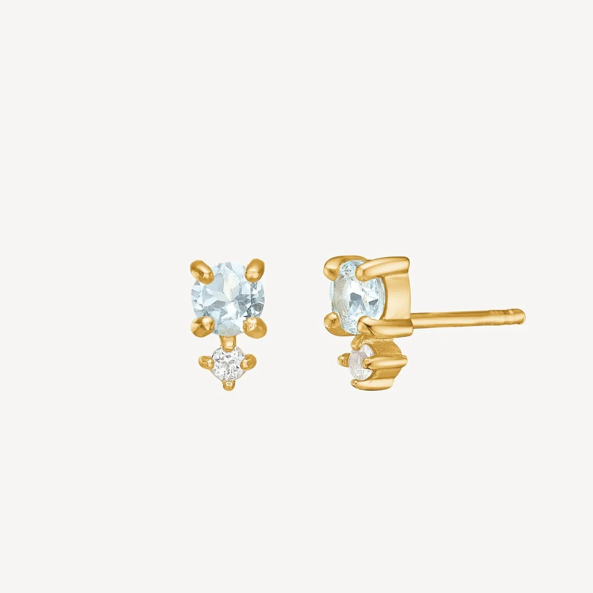 Carre Bon Bon earrings with blue topaz gold plated shows exclusive earrings with light blue stones and small clear detail. Model FS4445BT.