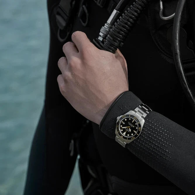 Certina DS Action Diver 40mm Powermatic 80 with black and yellow dial on diver's arm, Model C0484071105101