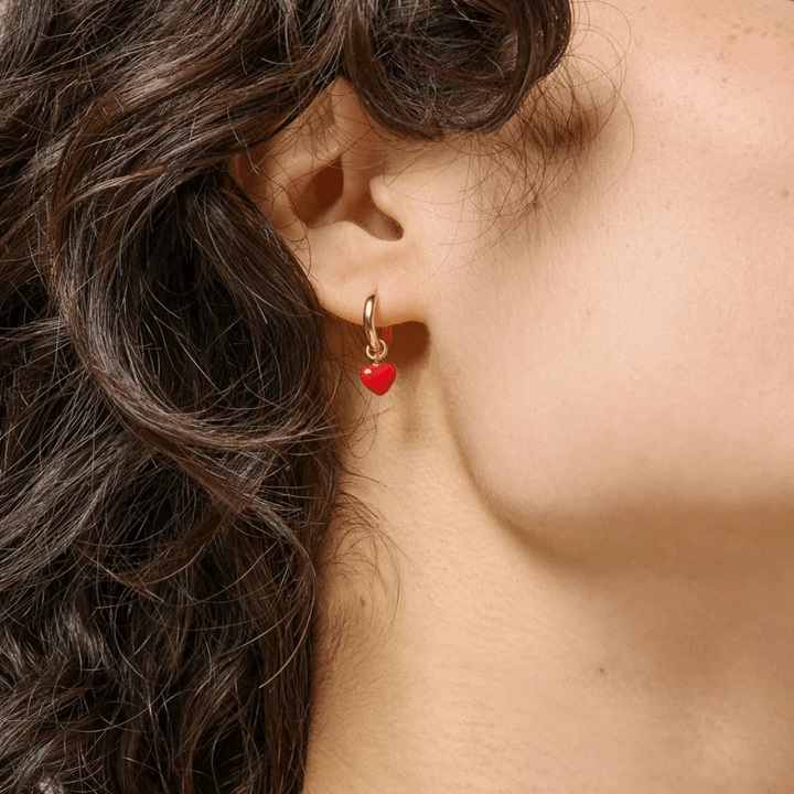 Enamel Amore Hoops Red Heart accent red heart earring in gold on the ear. Model e376g-red.