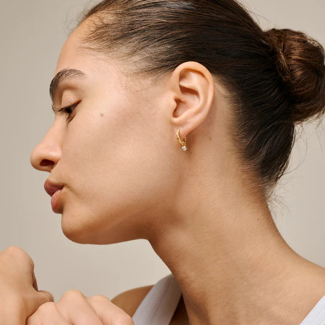 Enamel Belle Hoops CZ in gold plated silver worn by woman, single earring with clear stone. Model e431gm-2.