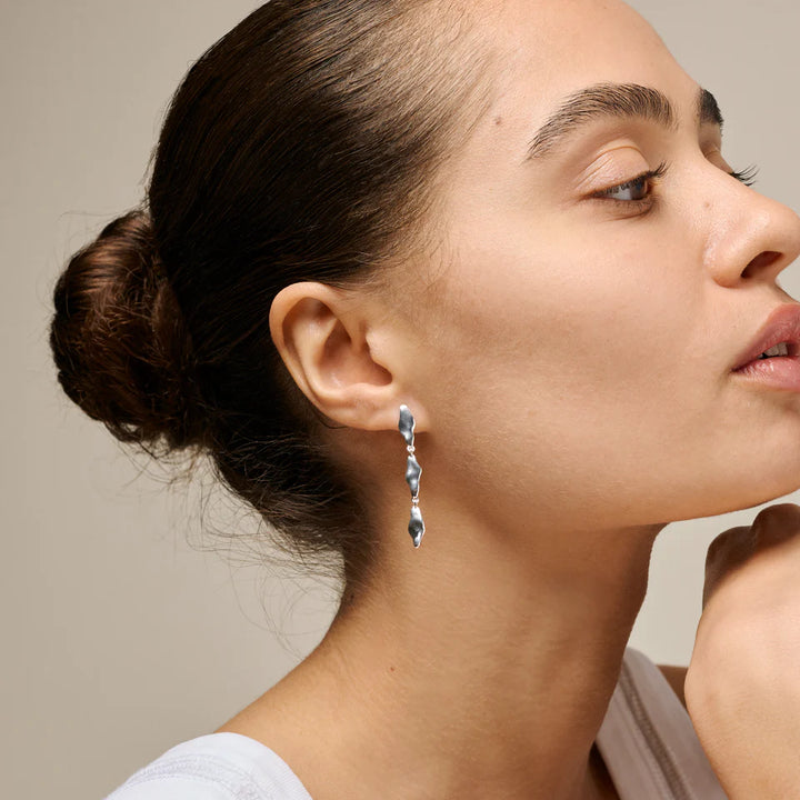 enamel india medium earrings in silver shown on woman, elegant and sculptural design, Model e435s-1