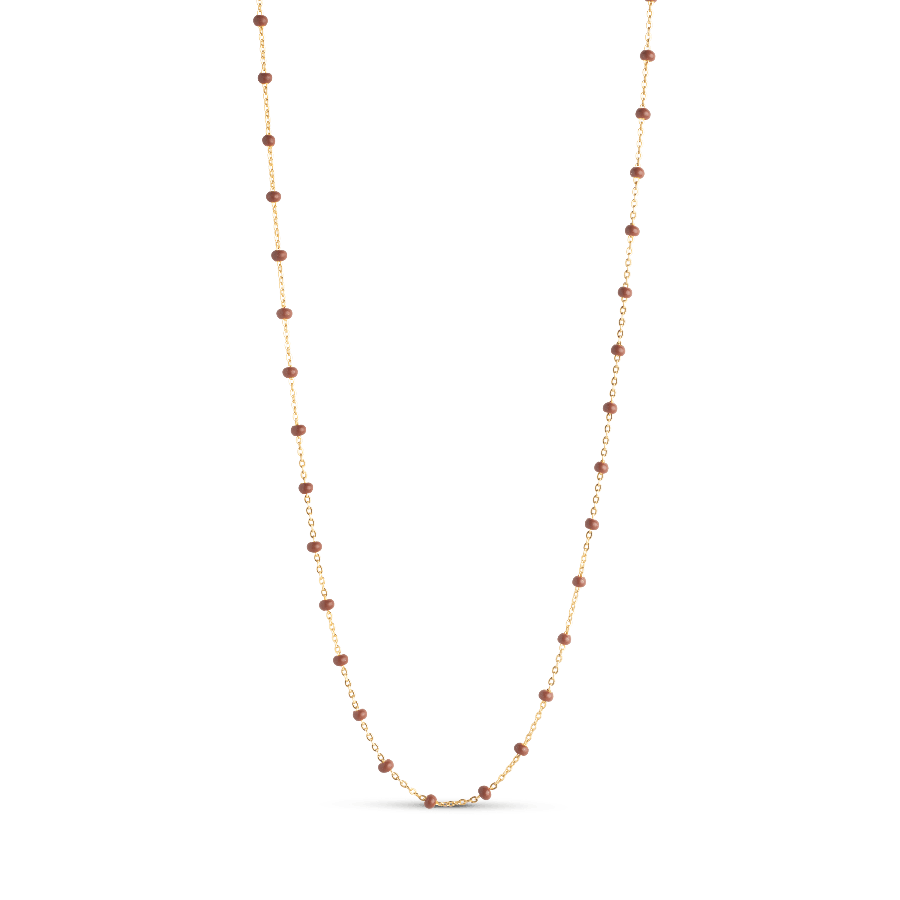 Enamel Lola Necklace Copper shows an elegant, thin gold chain with small copper colored pearls. Model copper-n55g-copper-n55g-copper-1