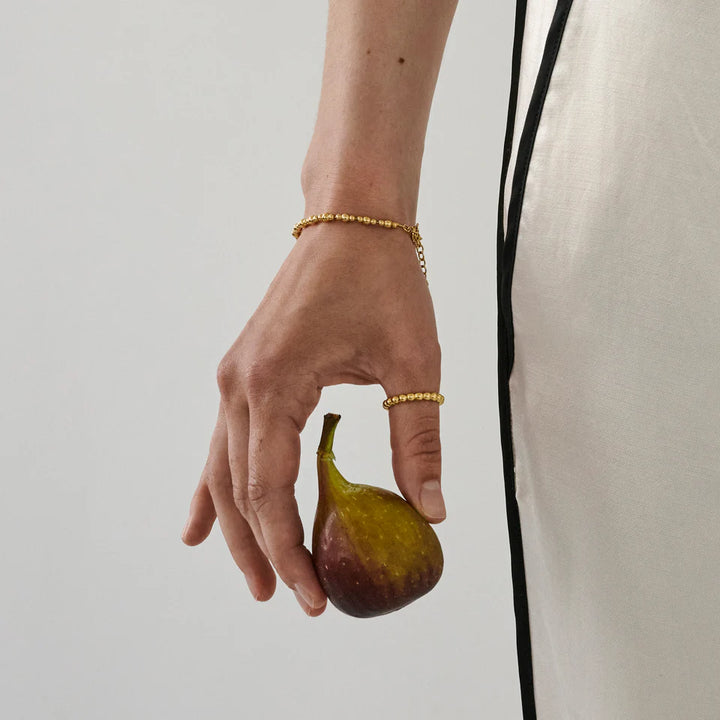 Enamel Norma Bead Bracelet in gold-plated silver accented on hand, worn with matching ring. Model b151g-2