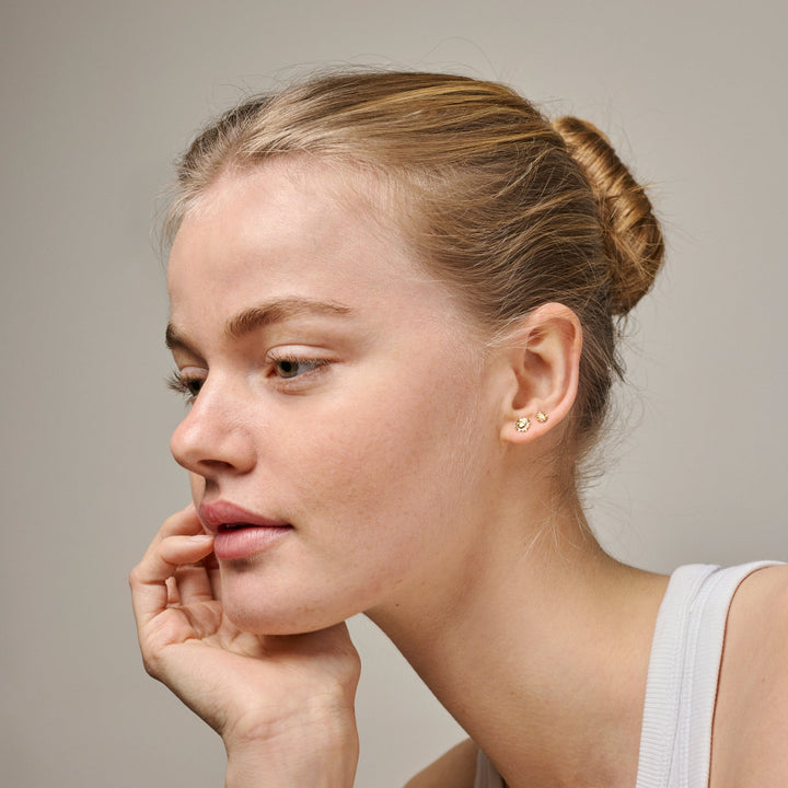 enamel small sunshine earrings e420g shown on model, elegant small gold earrings with sun design, Model e420g