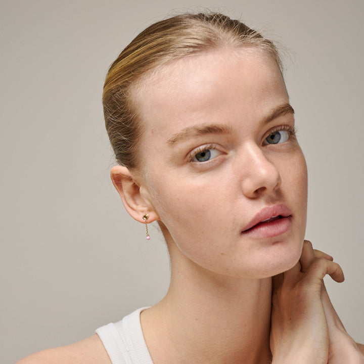 Enamel Sunshine Drop Earrings Pink can be seen on model with updo hair. Gold colored earrings with pink detail. Model e423g-pink-2.