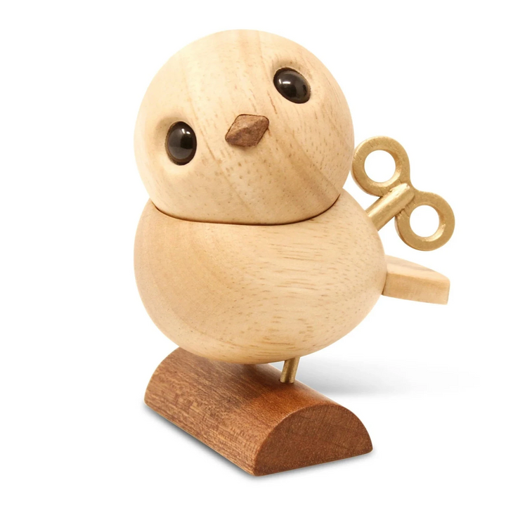 Fablewood HC Andersen's Nightingale shows a small wooden bird with a brass key and a dark foot. Model 8002-2.