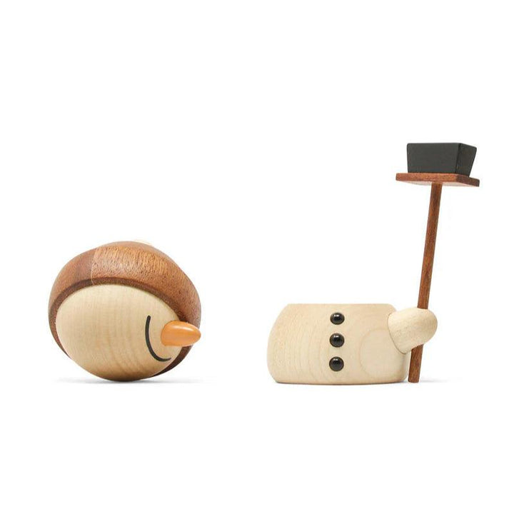 Fablewood Flurry the Snowman features a split wooden figure in light and dark wood with an orange nose and black hat. Model 1405-2