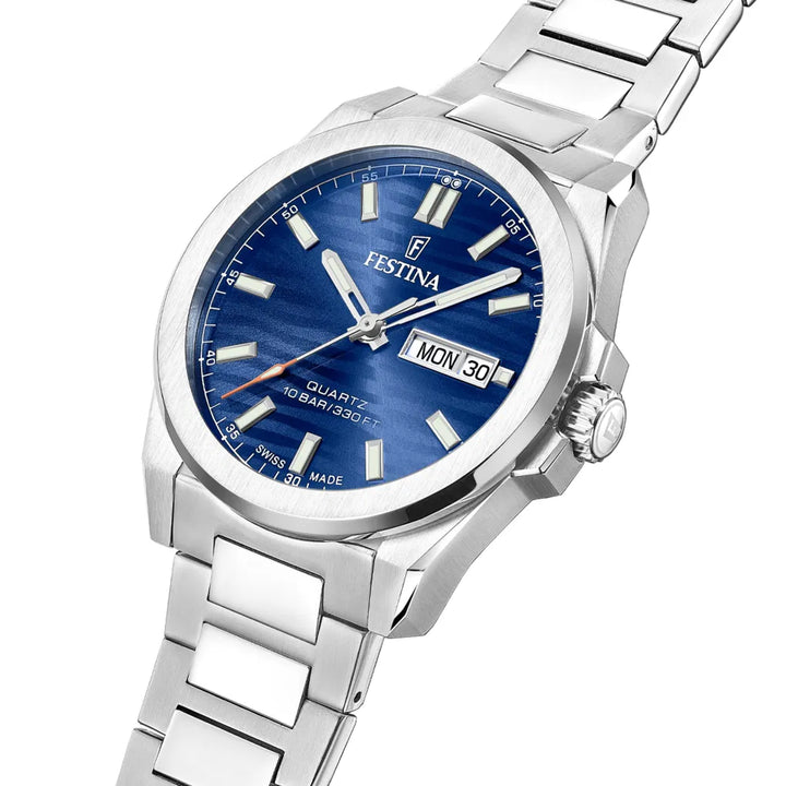 Festina Swiss Made Dune F200733 shows silver colored watch with blue dial and day-date. Model F200733-2