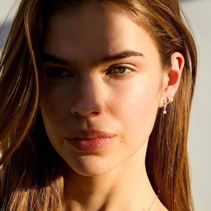 Hultquist Copenhagen Harper Pearl Silver Stud Earrings shown worn by model in sunlight, Model S08605S