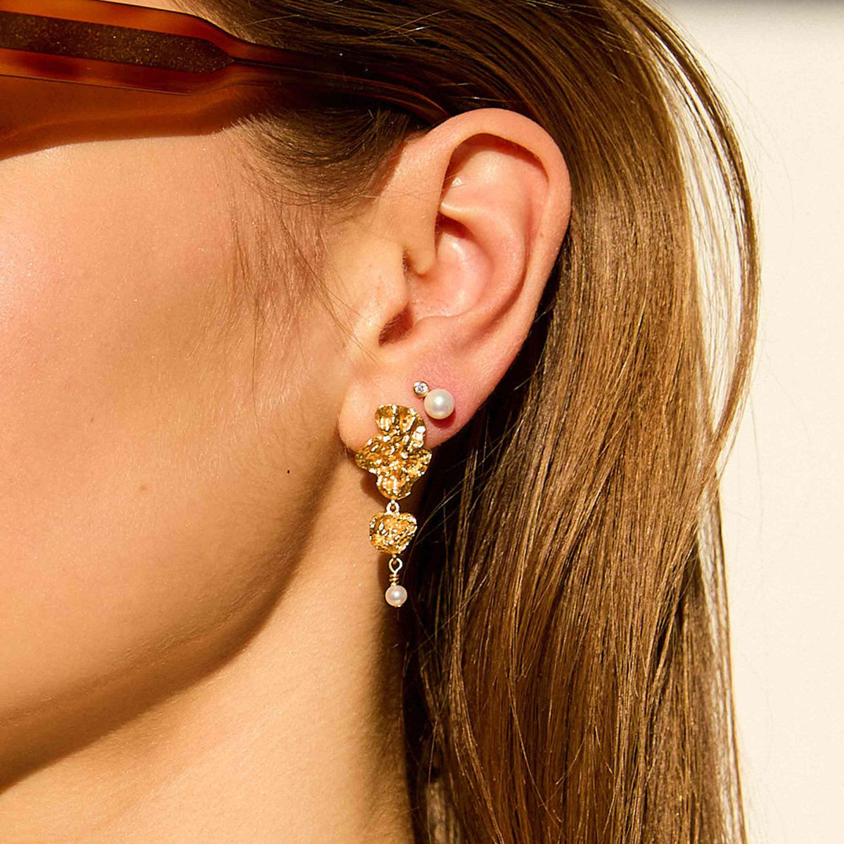 Hultquist Copenhagen Lainey Grande Gold Plated Pearl Earrings worn on the ear, Model S08609G-1.