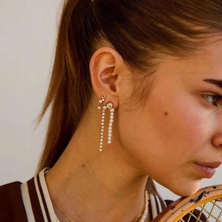 Hultquist Copenhagen Sienna Pearl gold plated earrings worn by woman, elegant with pearl details, Model S08608G-2.