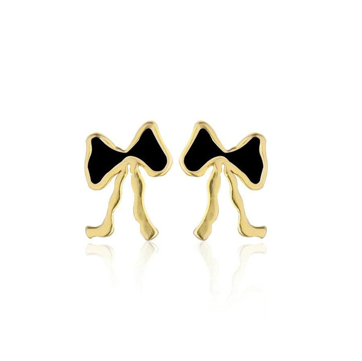jeberg-petite-bow-black-stud-bow-studs shows a pair of small bow studs in black and gold colored metal. Model 52805-1.
