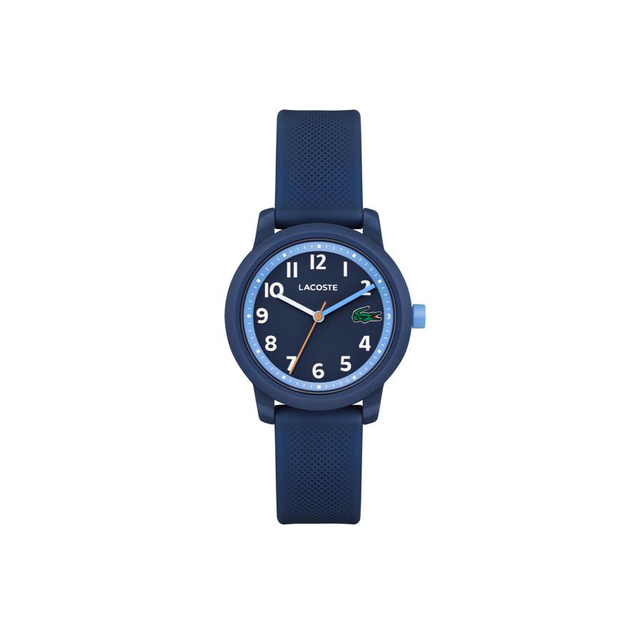 Lacoste Junior WATCH 12.12 BLA shows a blue watch with rubber strap and analog dial. Model 2030043.