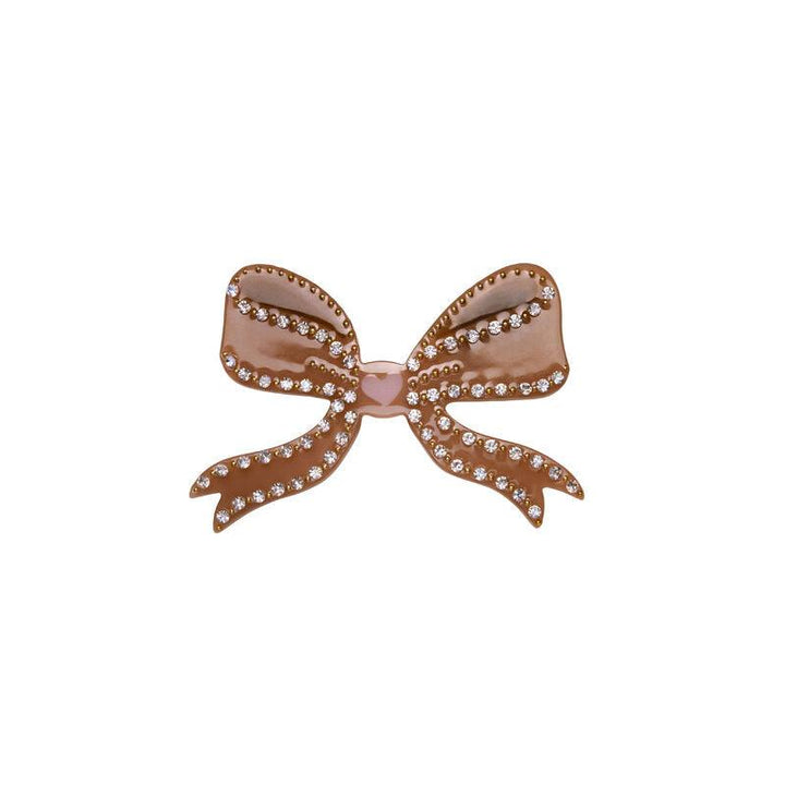The Moonstone Bow Hair Clip Mocha features a brown bow hair clip with sparkling stones. Model 4012-one size.