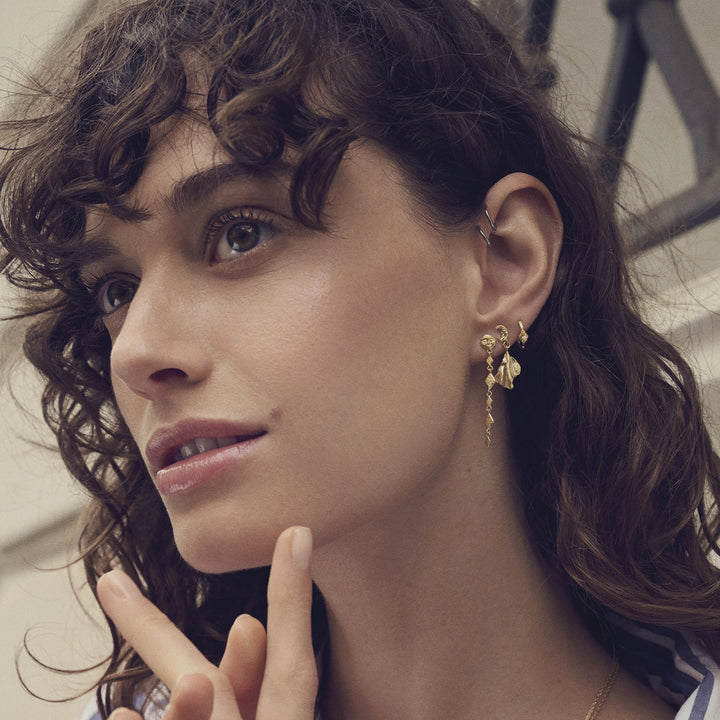 Maanesten Felicia gold-plated earrings are shown on model, elegant and feminine look, Model 10035a.