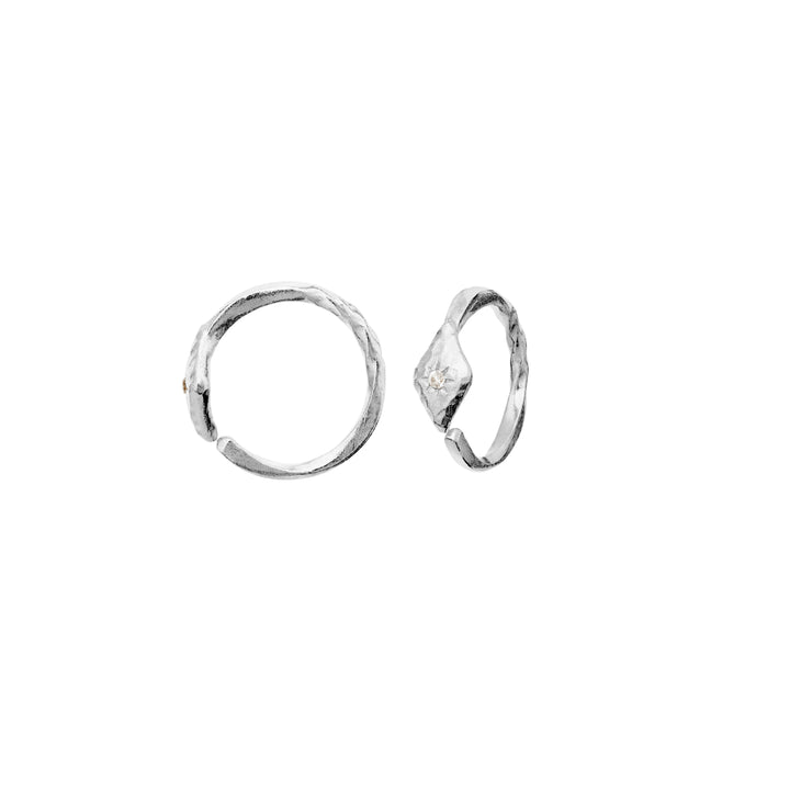 Maanesten Forte silver creoles with matte surface and small stone on a white background. Model 10021c