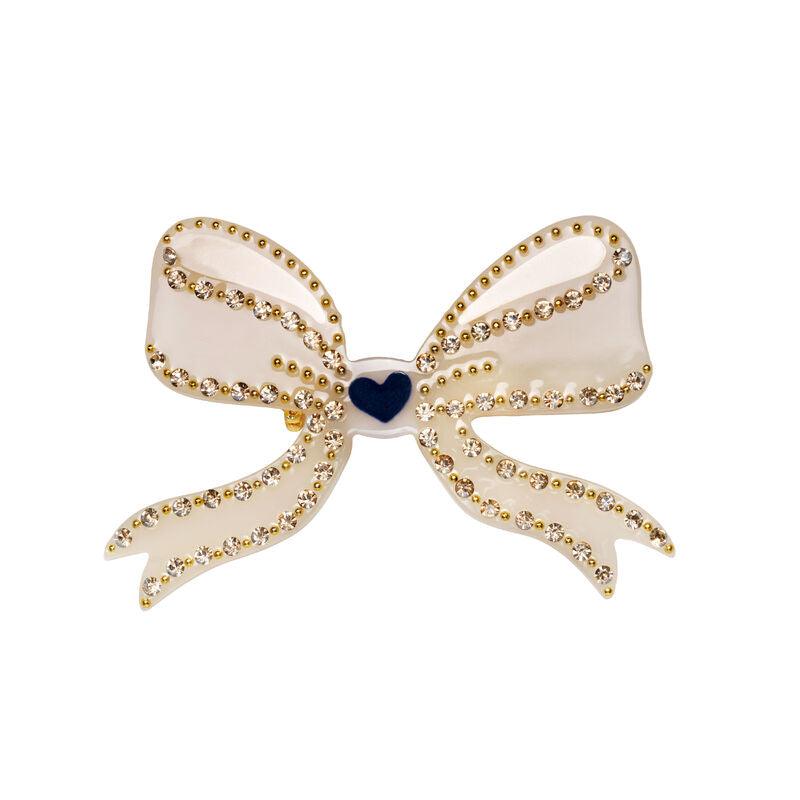 maanesten memoru brooch cream shows a cream colored bow brooch decorated with golden details, Model3991-onesize