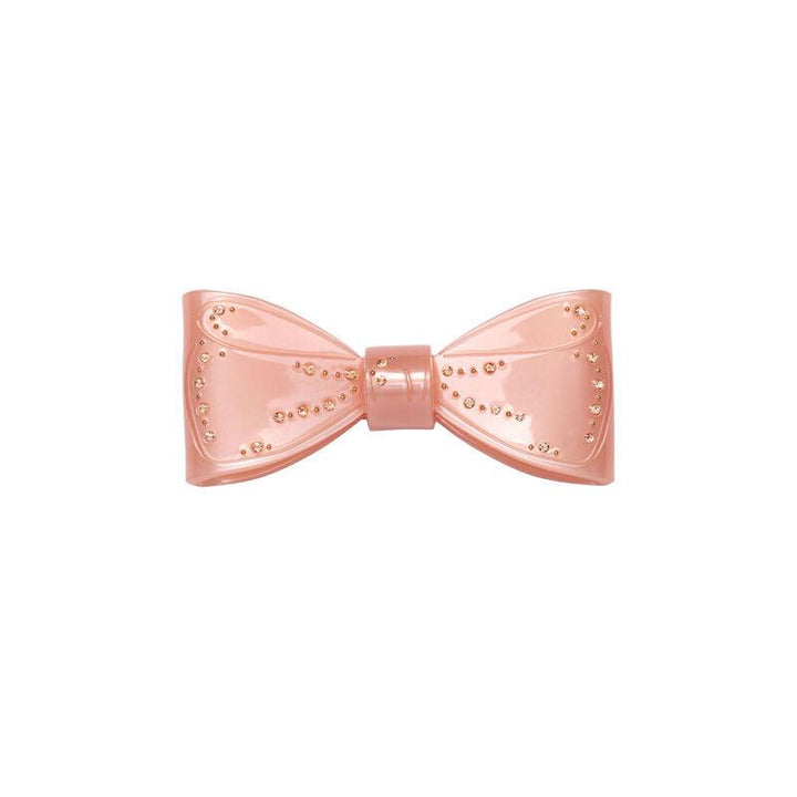 Maanesten Ribin Hair Clip Blush features a pink hair clip with golden bow details. Model 3979-one size.