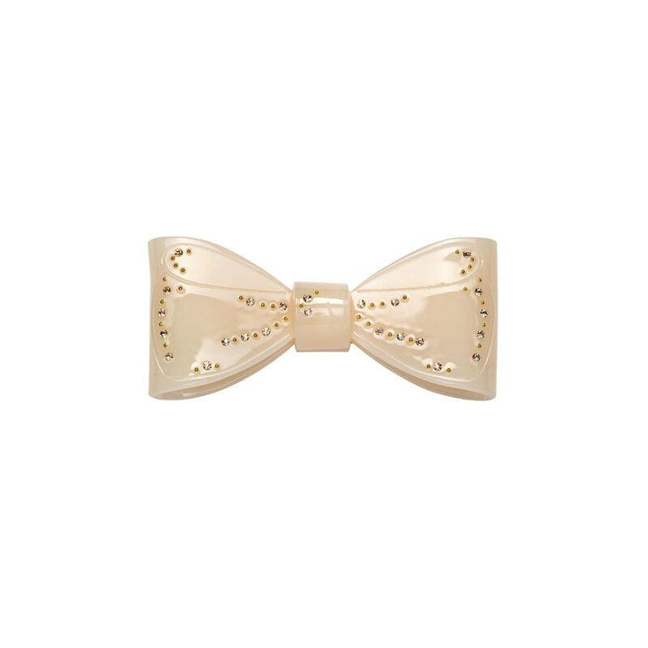 Maanesten Ribin Hair Clip Cream shows a cream-colored bow-shaped hair clip with golden details. Model 3981-one size