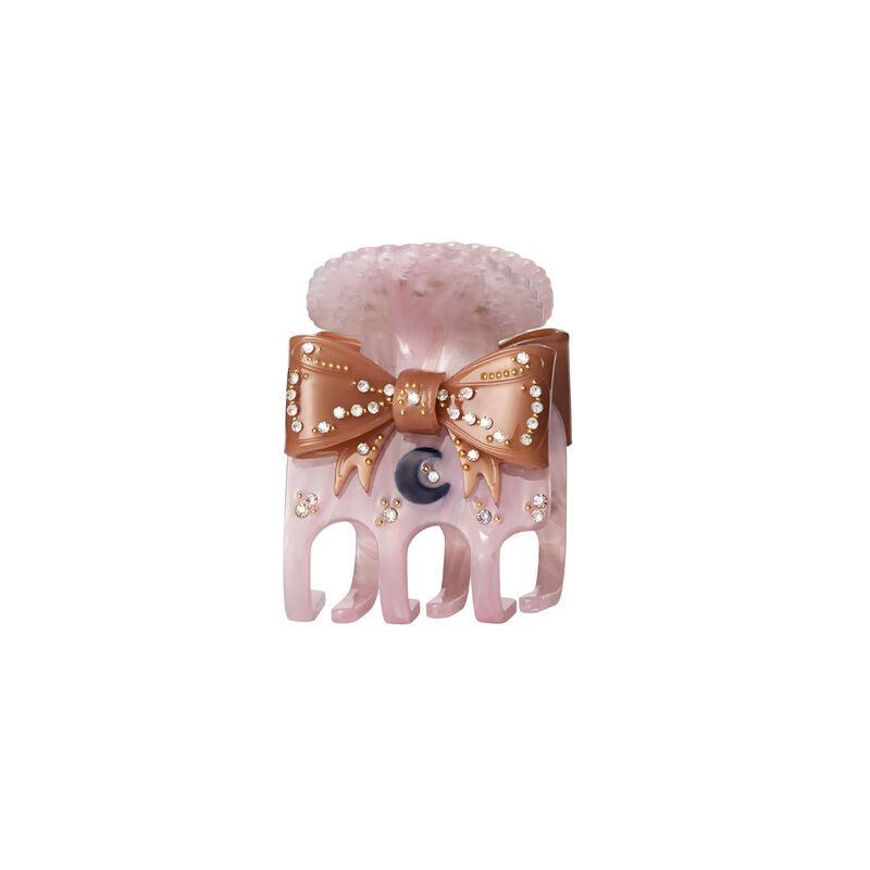 The Moonstone Ruku Hair Claw Dawn features a pink hair clip with a bow, pearl details and small stones. Model 3972-1.