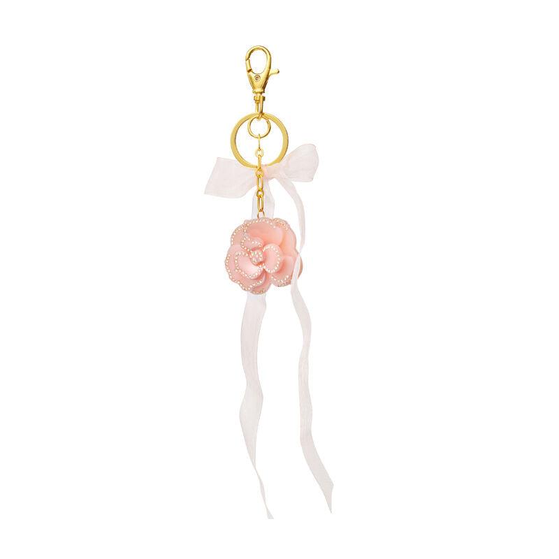 Moonstone Tenesa Keychain Blush features a pink floral key ring with pearl details, ribbon and golden pendant. Model 3990-one size