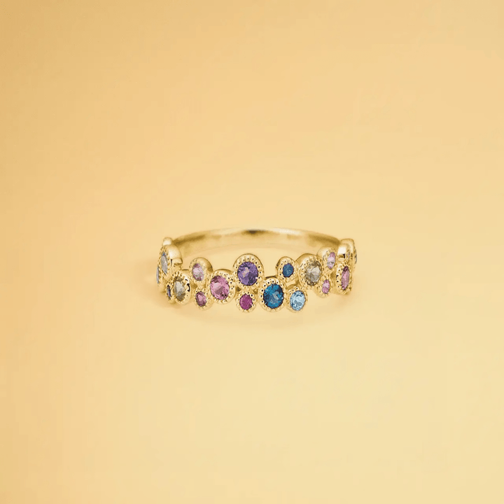 Mads Z 14kt Luxury Rainbow Petite Ring shown in gold with colored stones on light background. Model 1544066-001