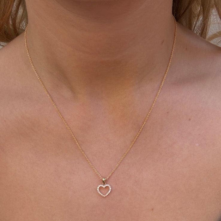 Mads Z 8kt Rhianna pendant heart motif 10mm seen on neck, open heart pendant in gold. Model 3337074