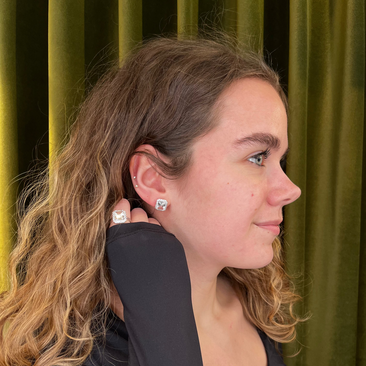 Mads Z Celestial by Medina Silver ring with white topaz seen on hand of woman in front of green background. Model 3146900-001