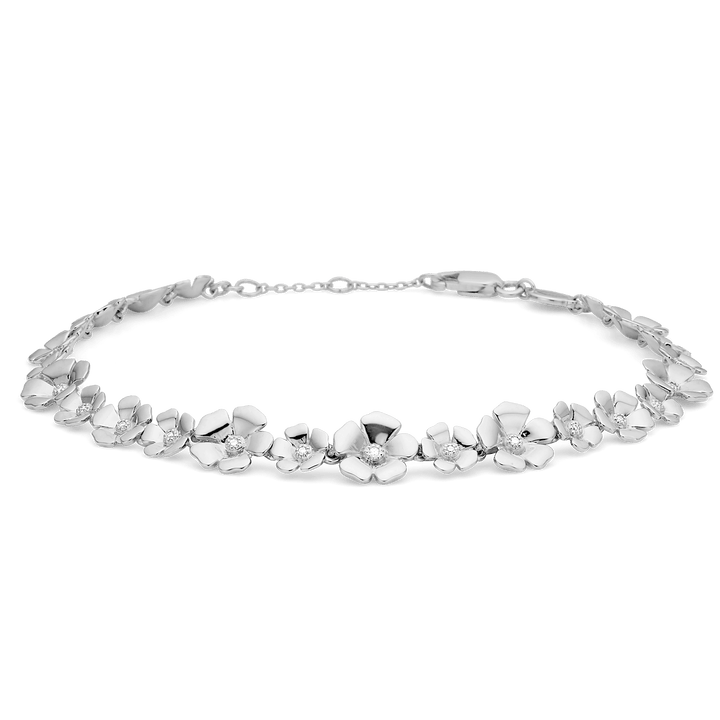 Mads Z Fleur silver bracelet with white topaz shows an elegant bracelet with flowers in silver and white stones. Model 2156108-1.