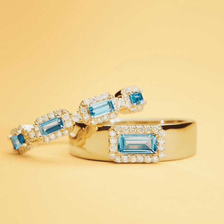 Mads Z Indigo 14kt Gold Ring Light Swiss Blue Topaz shows an elegant gold ring with blue topaz and diamond edge, Model1546191-001.