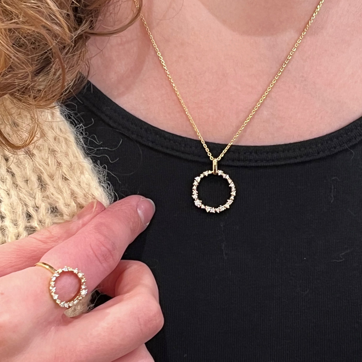 Mads Z Lucia Circle Ring in 14kt gold with diamonds worn on finger, detail. Model 1541054-001.