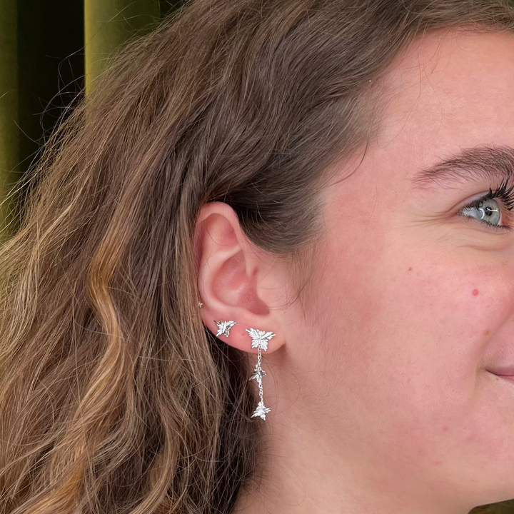 Mads Z Monarch butterfly earrings in silver with white topaz, beautifully worn on the ear. Model 2116156-2